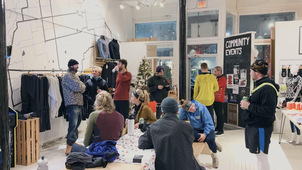 Community gathering at a local shop before the run